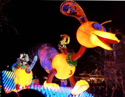 Photo illustrating Disneyland Main Street USA Paint the Night Parade Slink Dog Buzz Woody