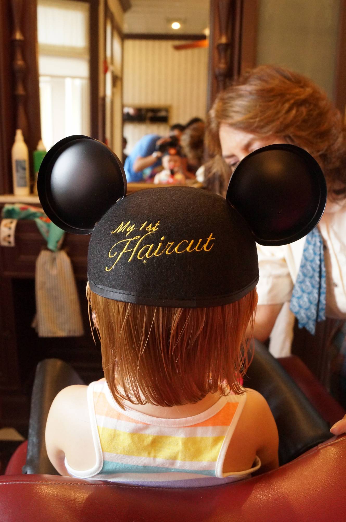 Little ones can get their first haircut at the Harmony Barber Shop in the Magic Kingdom |PassPorter.com