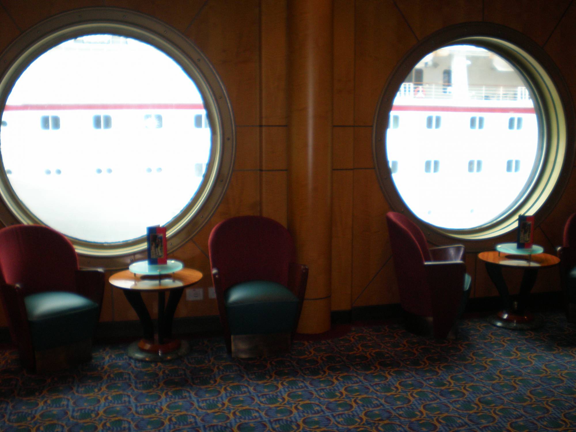 Porthole windows across from Promenade Lounge