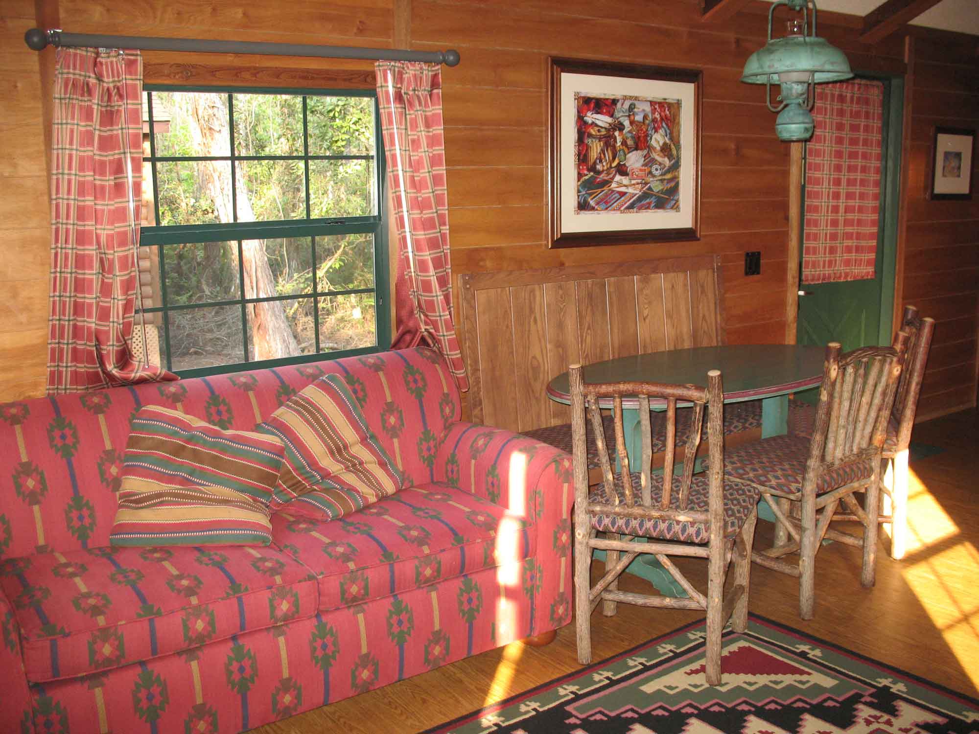 Fort Wilderness Cabin Living Room Detail - sofa, dining area and main entry