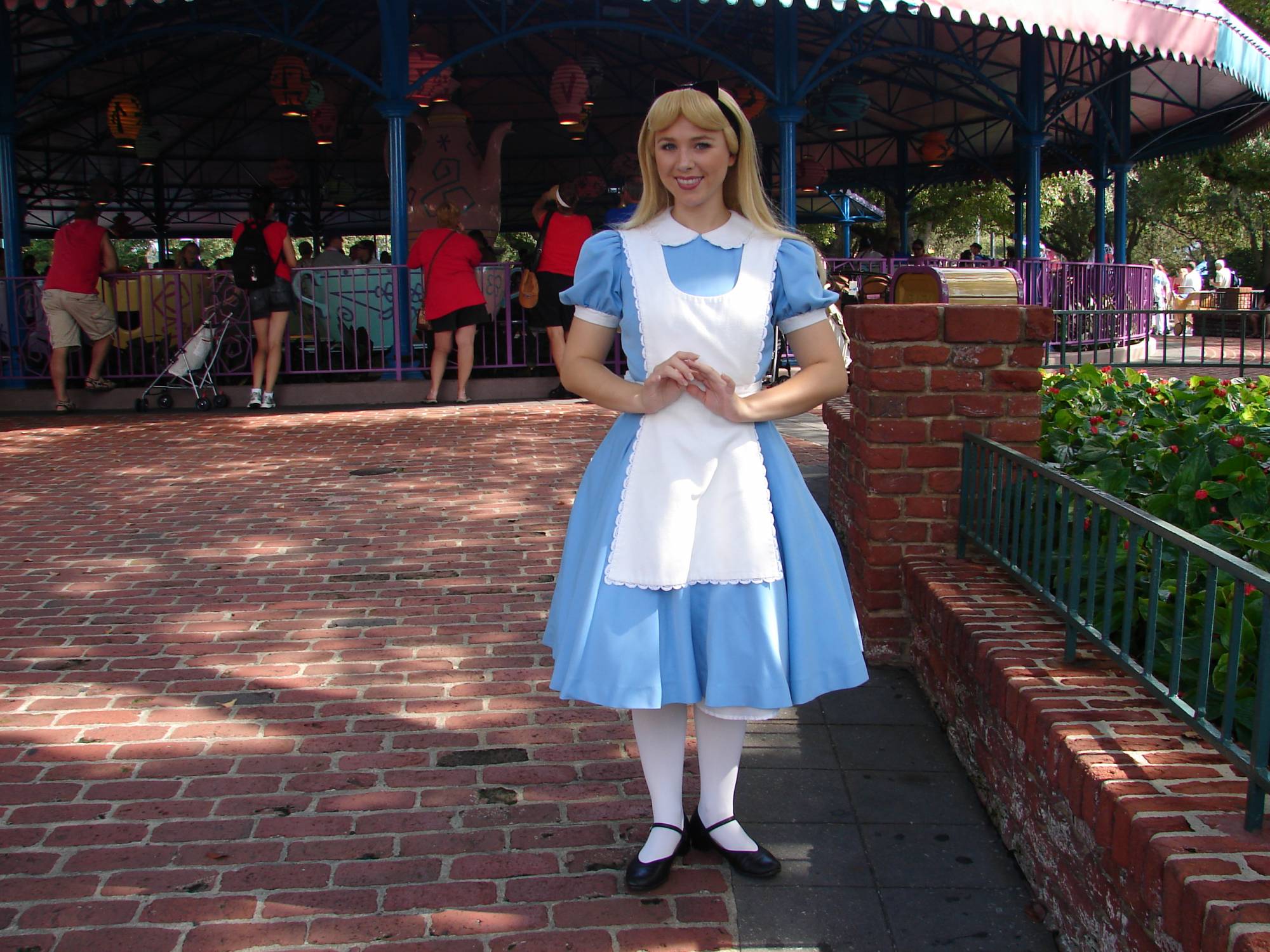 Alice in front of the Tea Cups