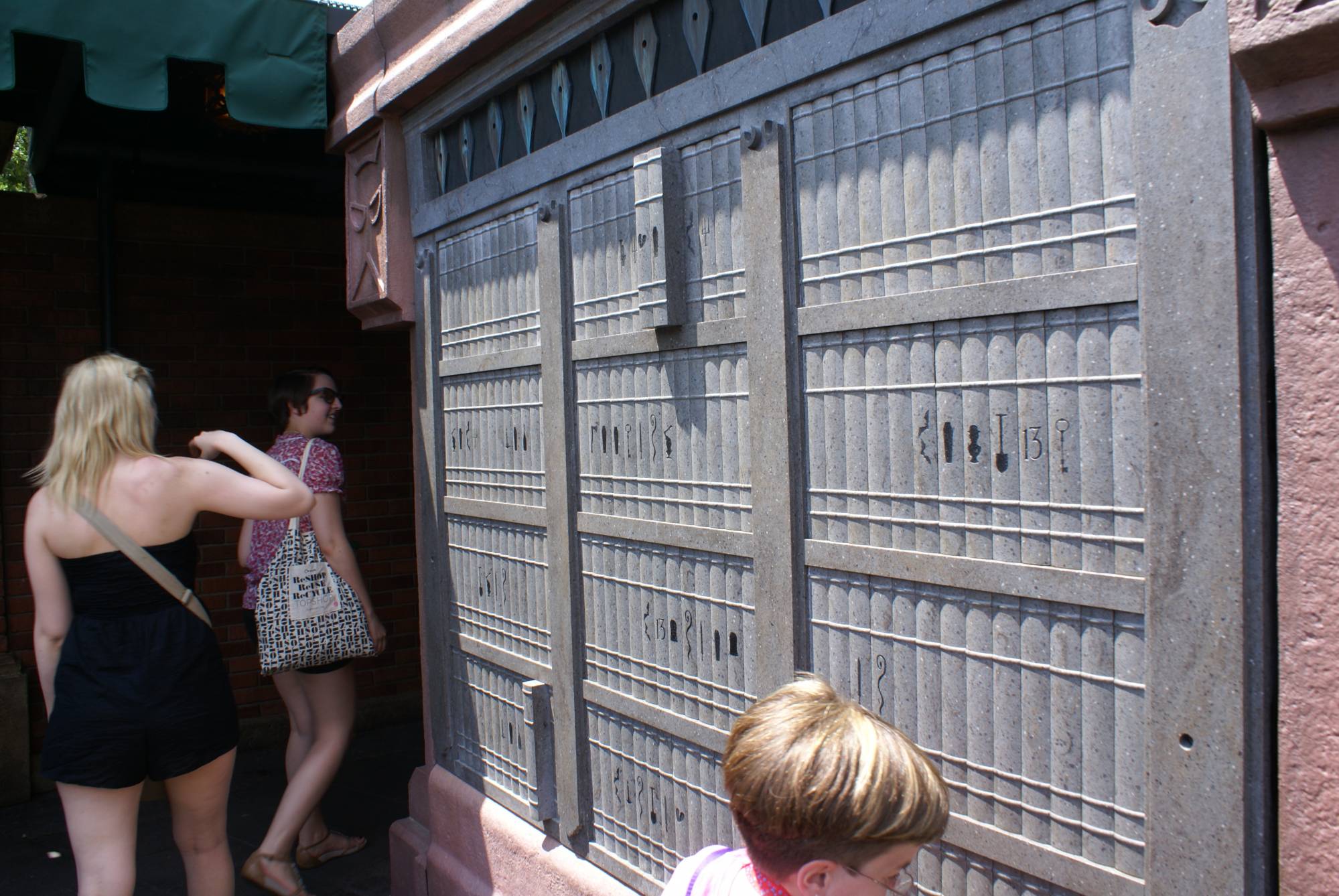 Bookshelves in Interactive Queue at Haunted Mansion