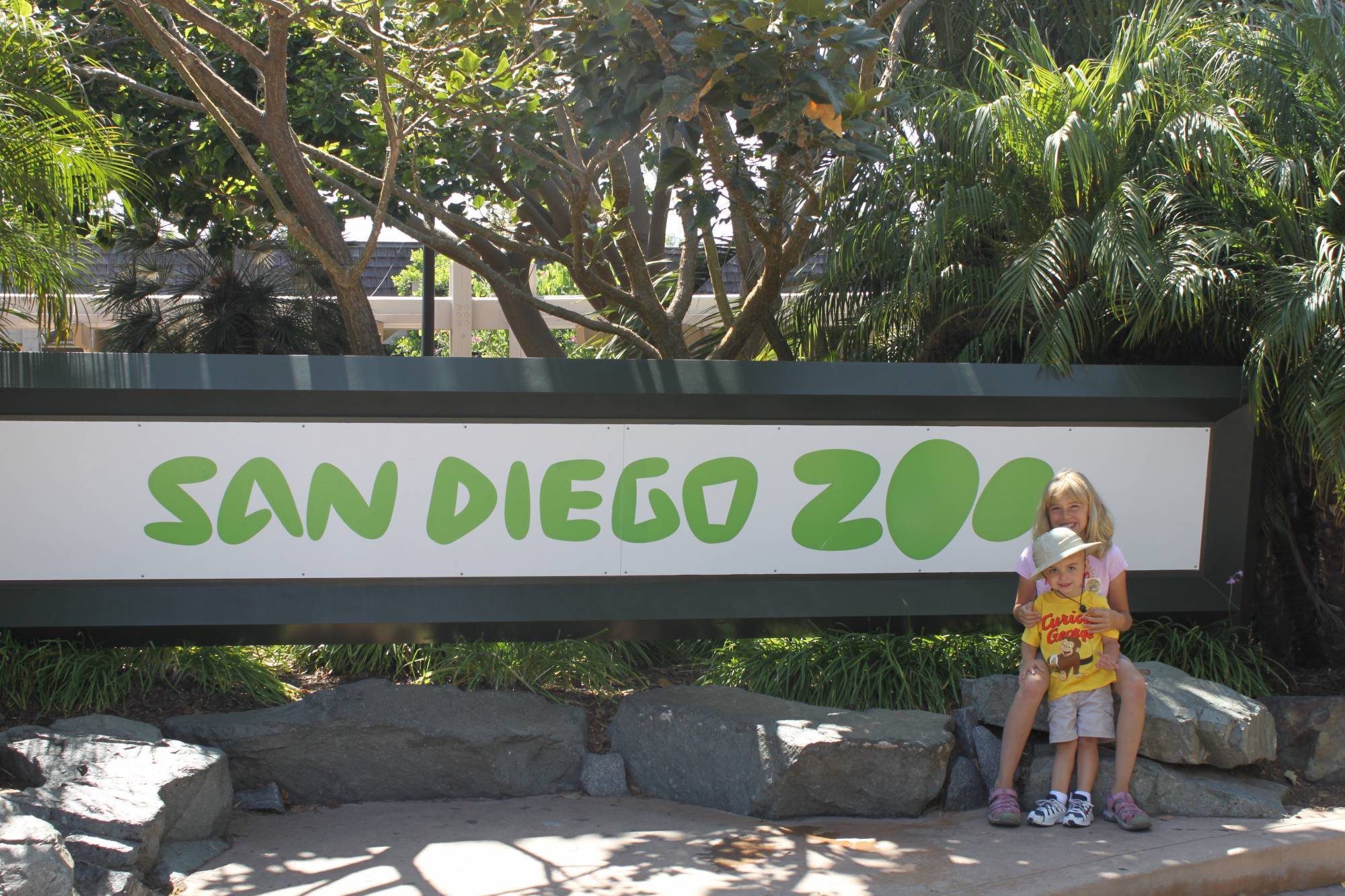 My kids in front of the (new) San Diego Zoo sign at the entrance