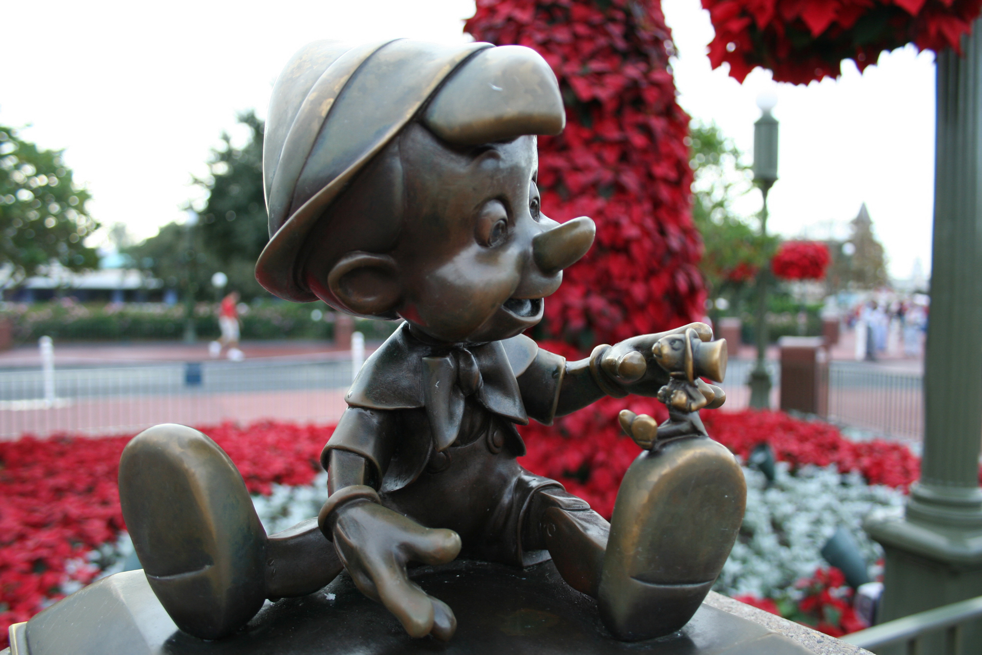 Pinocchio statue in front of Cinderella's Castle at the Magic Kingdom