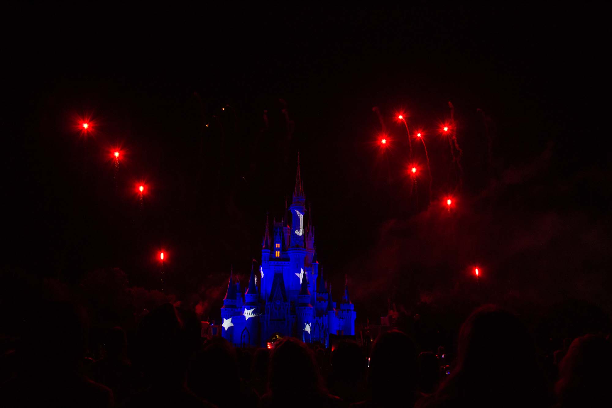 Wishes - Red Fireworks over Star Covered Castle