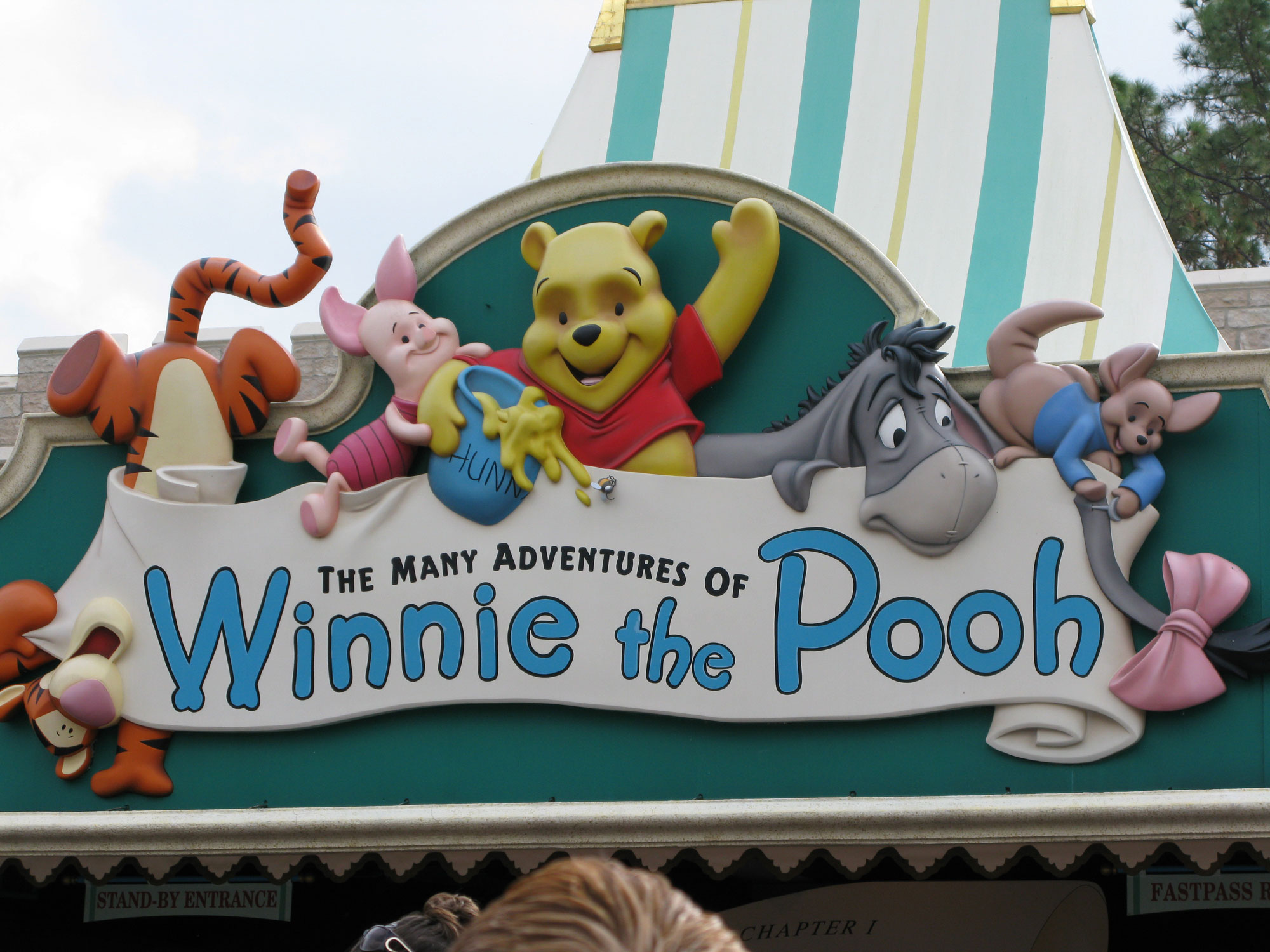Many Adventures of Winnie the Pooh sign